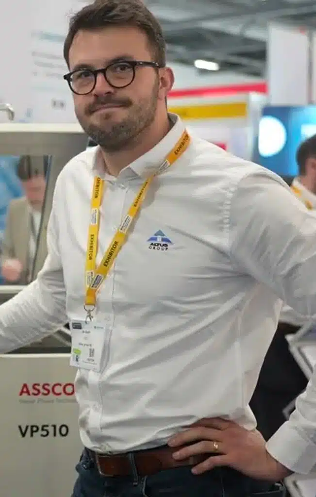 Man with lanyard at a professional exhibition