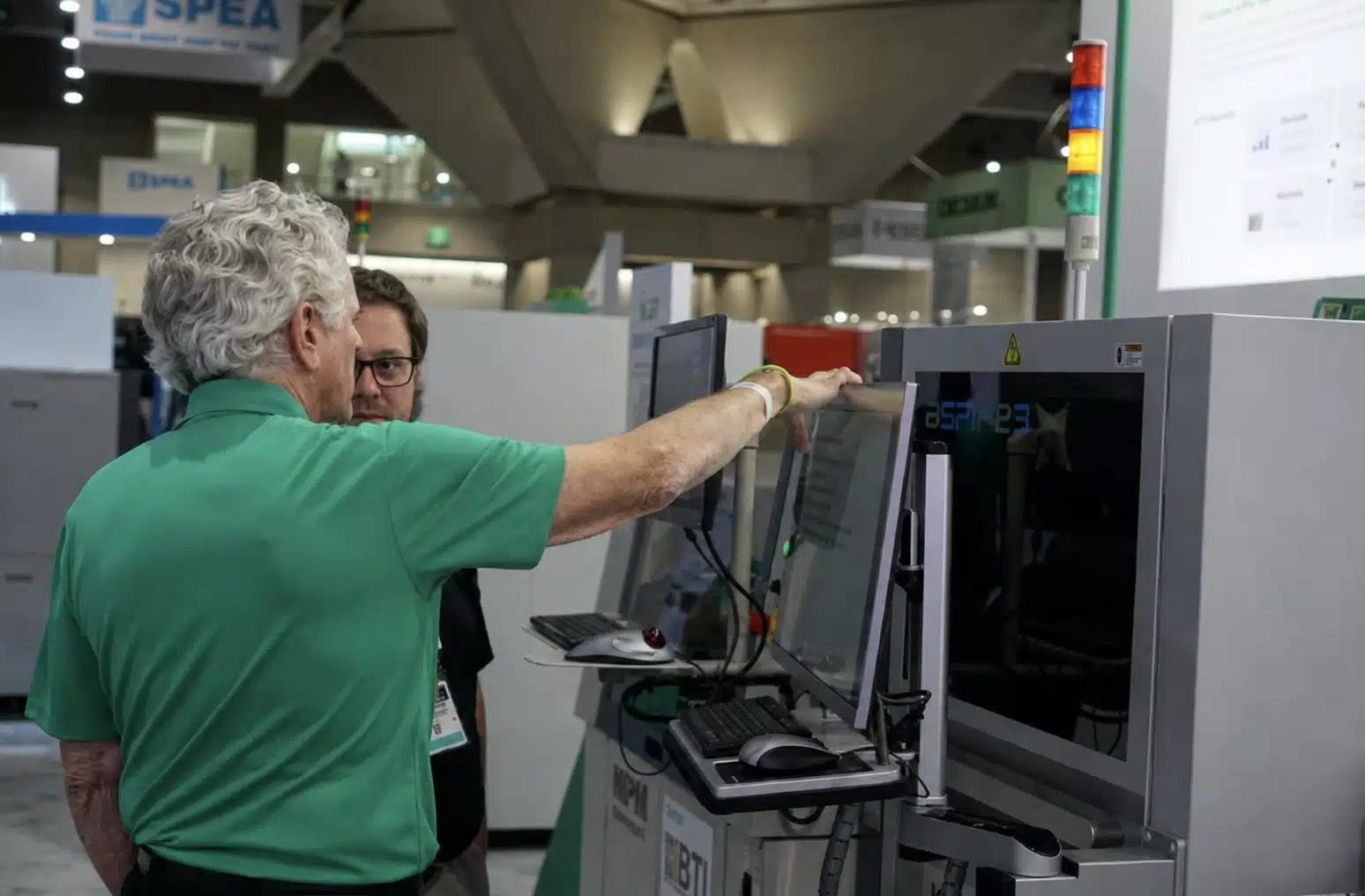 Attendees inspect industrial equipment at a trade show